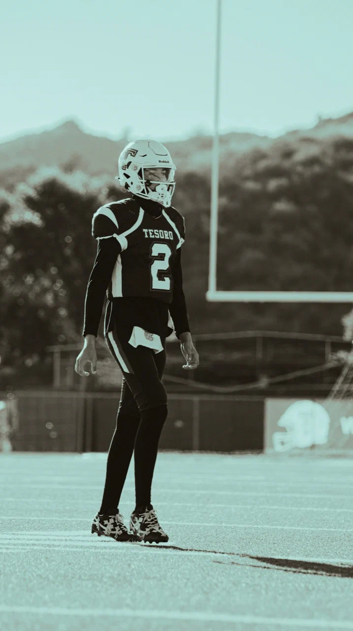 Jayden Hansen standing on the field in a number 2 uniform with goalposts behind him — 2025 freshman season