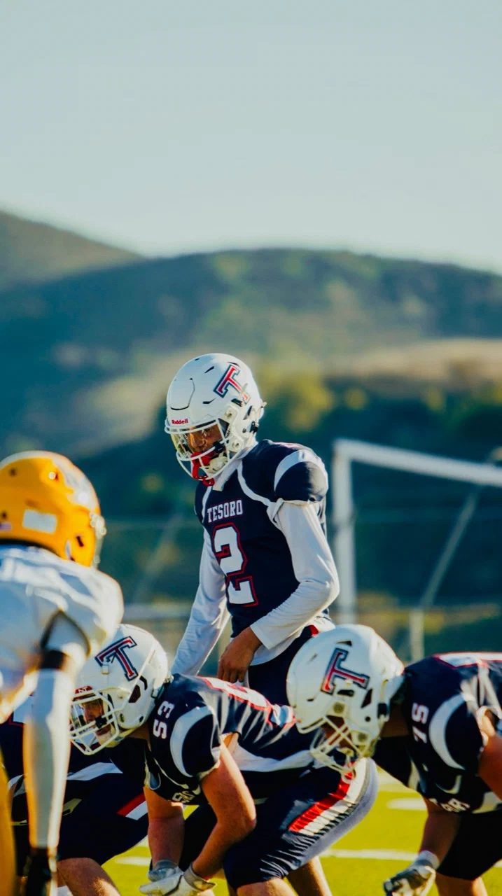 Jayden Hansen wearing number 2 behind the Tesoro offensive line before a snap — 2025 freshman season