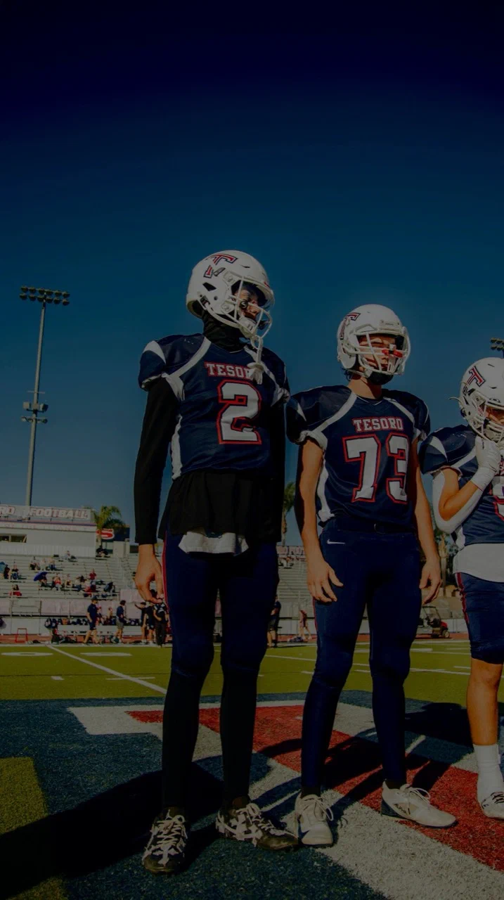 Jayden Hansen wearing number 2 standing beside Tesoro teammates on the field — 2025 freshman season